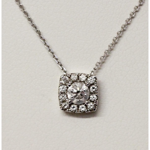 669 - A modern diamond pendant, in 9ct white gold on fine link 9ct white gold chain