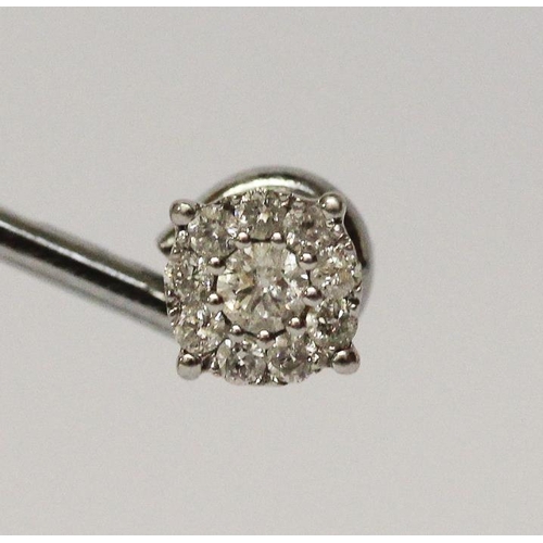 670 - A pair of modern diamond ear studs, with safety screw posts, 9ct white gold.