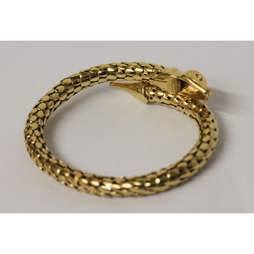 674 - A snake bangle, of sprung design in 18ct yellow gold, marked 750. Total weight 35.4 grams