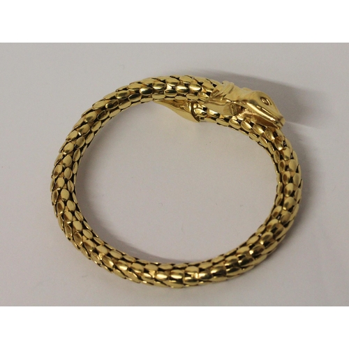 674 - A snake bangle, of sprung design in 18ct yellow gold, marked 750. Total weight 35.4 grams