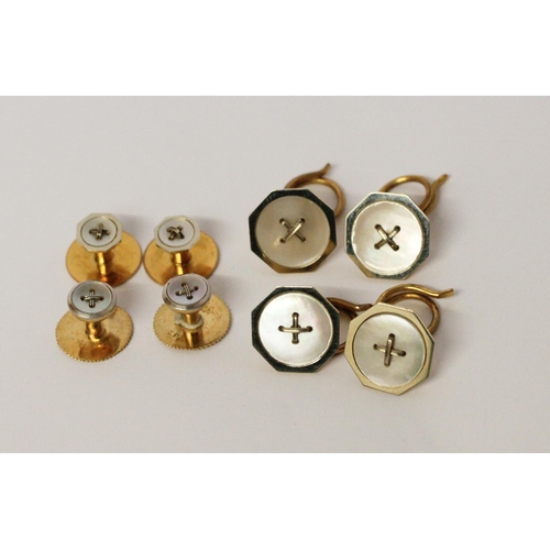 682 - Two cased 18ct gold gentleman's shirt studs sets, both set with mother of pearl button motifs.