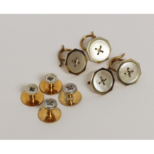 682 - Two cased 18ct gold gentleman's shirt studs sets, both set with mother of pearl button motifs.