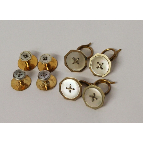 682 - Two cased 18ct gold gentleman's shirt studs sets, both set with mother of pearl button motifs.