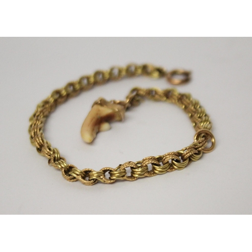 714 - Victorian gold chain bracelet, 4.8 grams. set with canine tooth charm.