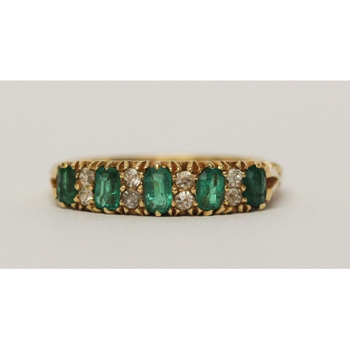 715 - 18ct emerald and diamond half hoop ring, in carved setting, hallmarked. Ring size N Weight 4.6 g