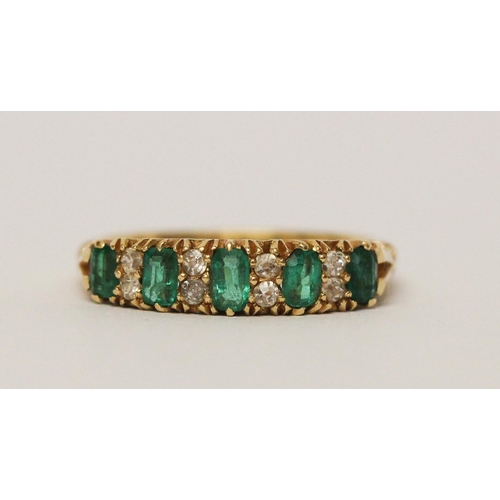 715 - 18ct emerald and diamond half hoop ring, in carved setting, hallmarked. Ring size N Weight 4.6 g