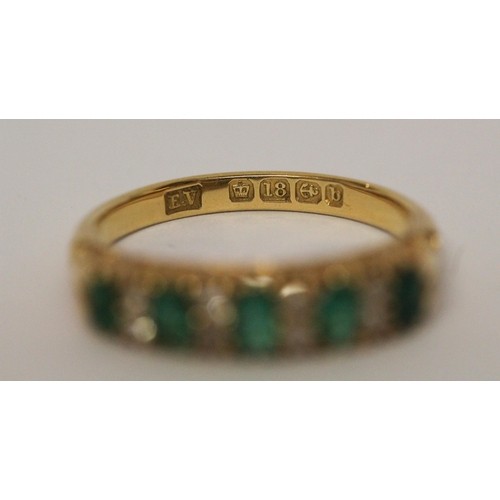 715 - 18ct emerald and diamond half hoop ring, in carved setting, hallmarked. Ring size N Weight 4.6 g