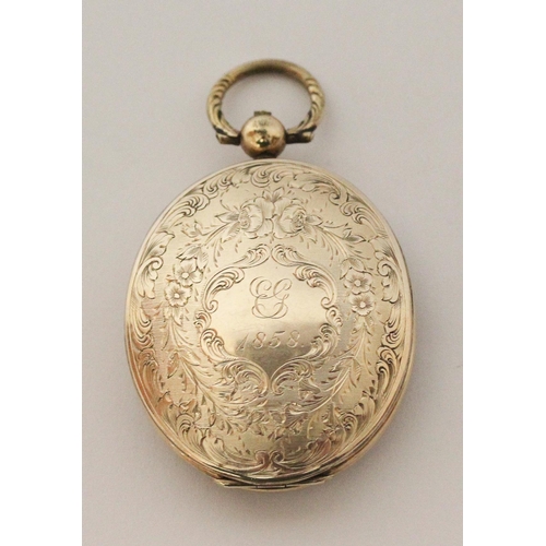 716 - Victorian oval yellow metal locket, with initials engraved to front cartouche, dated 1858. 6 cms lon... 