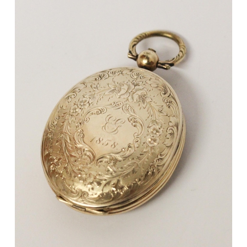 716 - Victorian oval yellow metal locket, with initials engraved to front cartouche, dated 1858. 6 cms lon... 