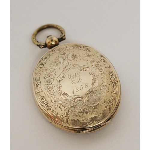 716 - Victorian oval yellow metal locket, with initials engraved to front cartouche, dated 1858. 6 cms lon... 