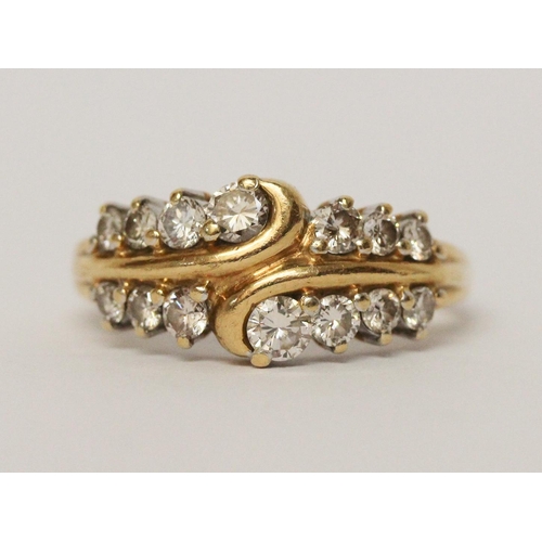 723 - A diamond dress ring, set two rows of brilliant cut diamonds on 18ct yellow gold band, hallmarked ri... 