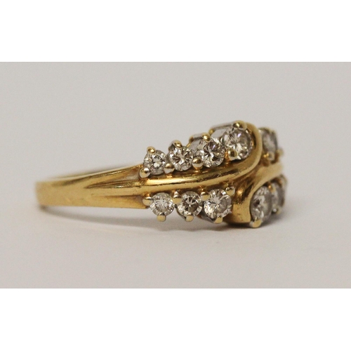 723 - A diamond dress ring, set two rows of brilliant cut diamonds on 18ct yellow gold band, hallmarked ri... 