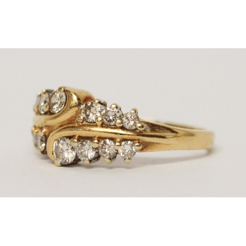 723 - A diamond dress ring, set two rows of brilliant cut diamonds on 18ct yellow gold band, hallmarked ri... 