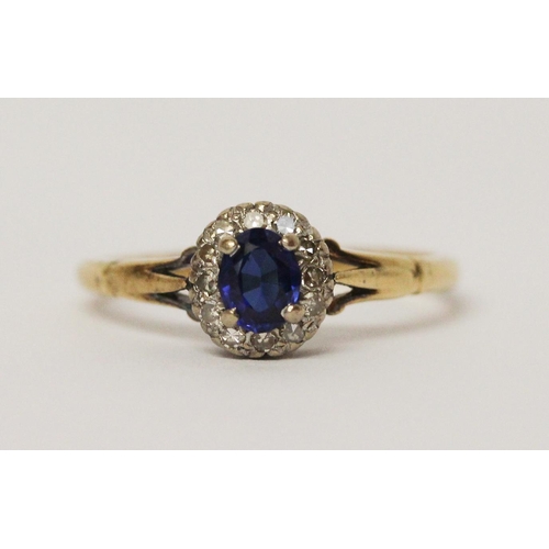 725 - Vintage sapphire and diamond oval cluster ring, on 18ct yellow gold band. Ring size N weight 2.6g