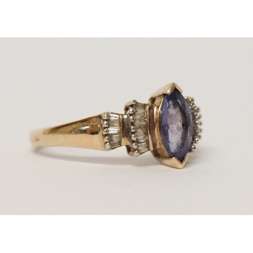 726 - A modern 9ct yellow gold tanzanite and diamond ladies dress ring, ring size O, weight 2.7g