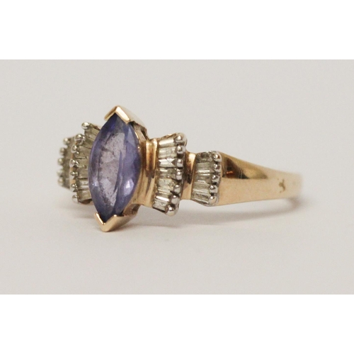 726 - A modern 9ct yellow gold tanzanite and diamond ladies dress ring, ring size O, weight 2.7g