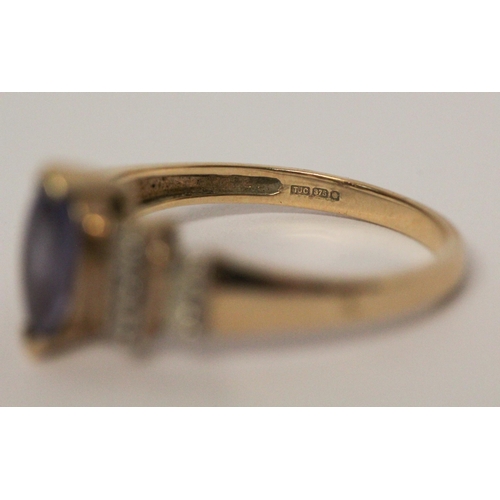 726 - A modern 9ct yellow gold tanzanite and diamond ladies dress ring, ring size O, weight 2.7g