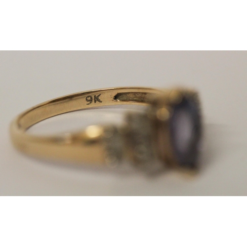 726 - A modern 9ct yellow gold tanzanite and diamond ladies dress ring, ring size O, weight 2.7g