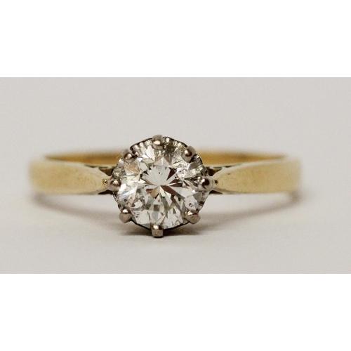 730 - A solitaire diamond engagement ring, set with a circular claw set brilliant cut diamond weighing 75 ... 