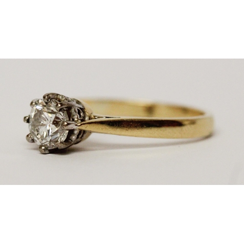 730 - A solitaire diamond engagement ring, set with a circular claw set brilliant cut diamond weighing 75 ... 