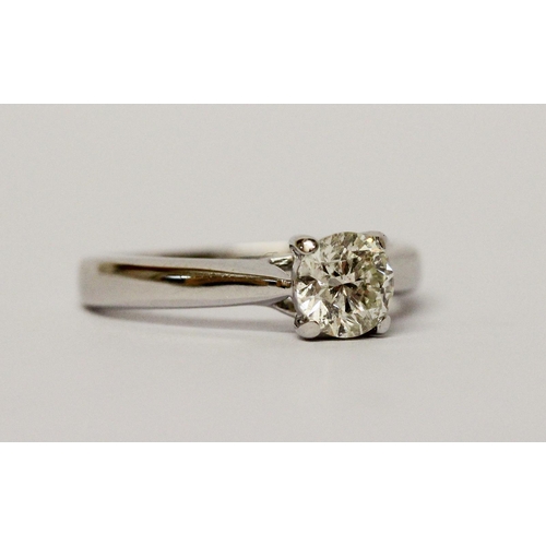 732 - A Diamond engagement ring, solitaire brilliant cut diamond weighing 95 points within simple claw set... 