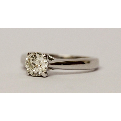 732 - A Diamond engagement ring, solitaire brilliant cut diamond weighing 95 points within simple claw set... 