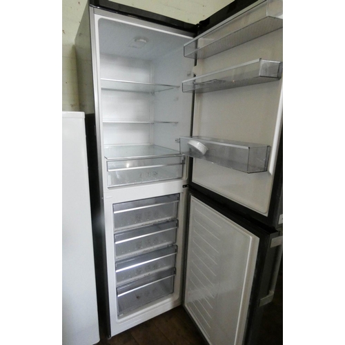 854 - A Blomberg 6' tall half and half fridge freezer in silver case