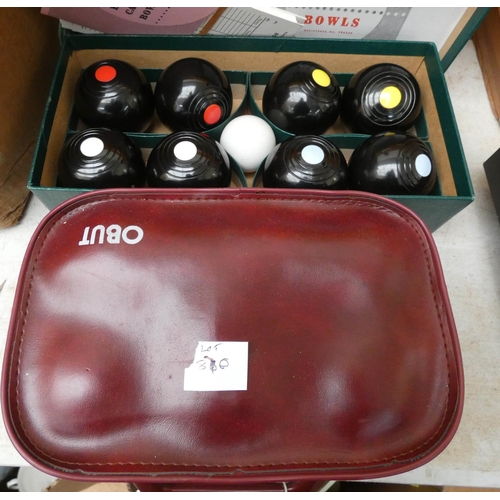 870 - A set of B&A carpet bowls and a set of French boules in carrying case