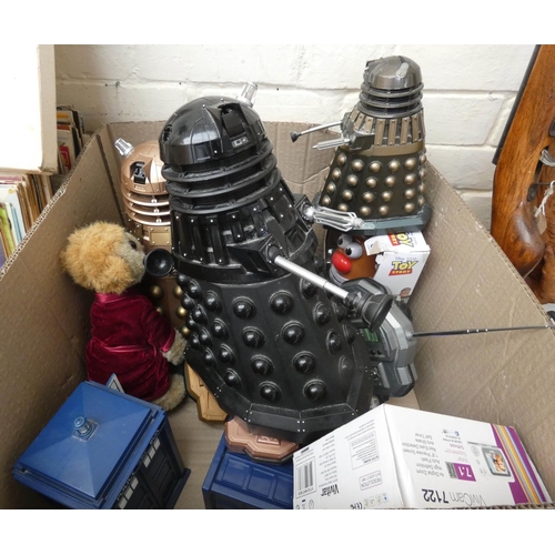 873 - A large box containing several remote control Daleks, Toy Story figures, mobile phone, Doctor Who Ta... 