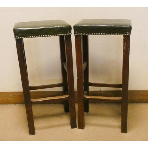 394 - Pair of oak bars stools with green antique leather studded tops