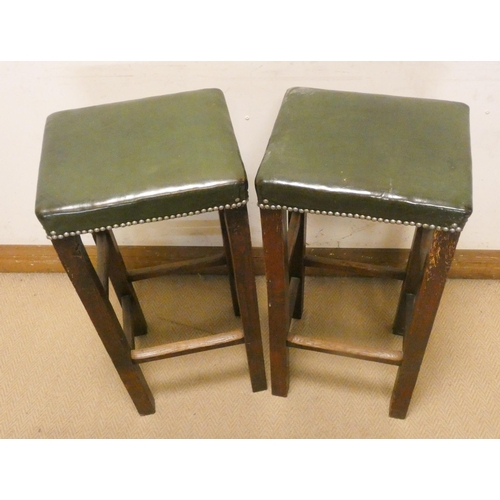 394 - Pair of oak bars stools with green antique leather studded tops