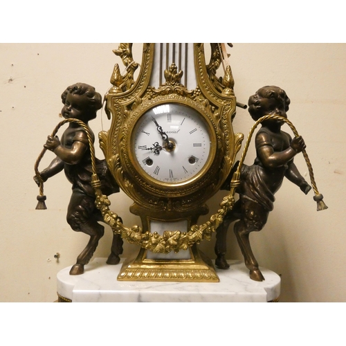 424 - Franz Hermle - An Italian gilt figure mounted striking mantel clock on marble base, movement marked ... 