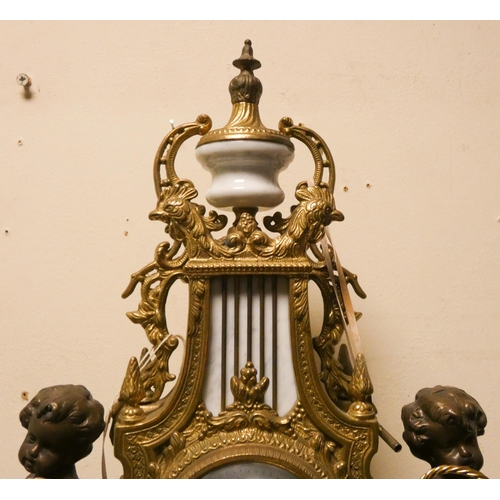 424 - Franz Hermle - An Italian gilt figure mounted striking mantel clock on marble base, movement marked ... 