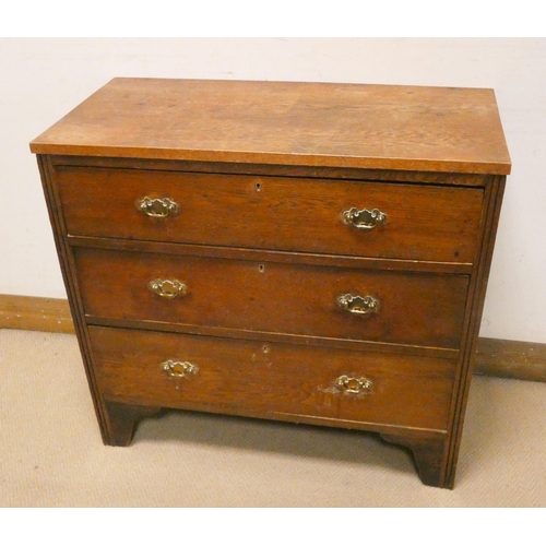 430 - Oak chest of three long drawers with brass handles on bracket feet, 34