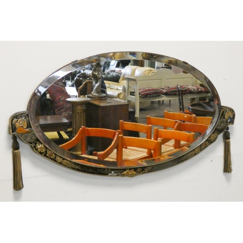 433 - A 1920's Chinoiserie framed oval wall mirror. Approx 31 ½” widest point to point and 16 ½” top to bo... 