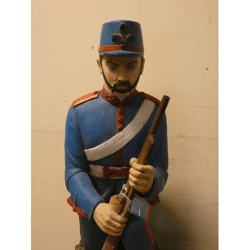 454 - Decorative figure of a kneeling Foreign Legion soldier, 28.5