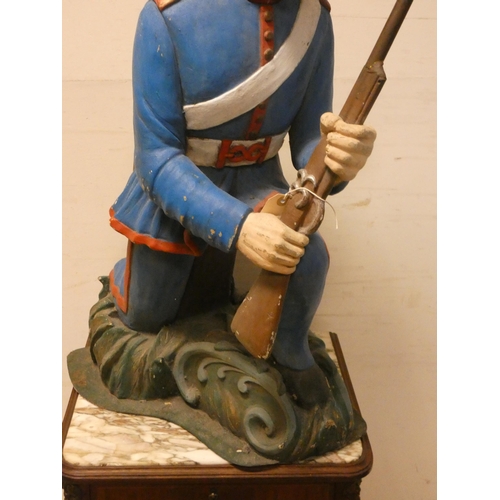 454 - Decorative figure of a kneeling Foreign Legion soldier, 28.5