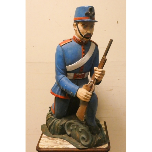 454 - Decorative figure of a kneeling Foreign Legion soldier, 28.5