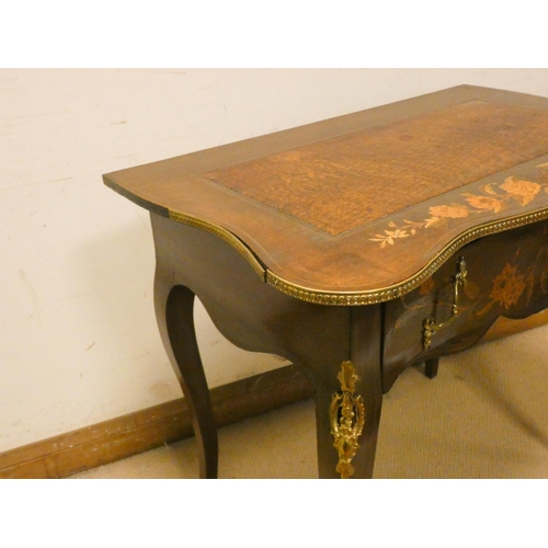 474 - French floral marquetry decorated shaped top writing table, with drawer, gilt metal mounts on cabrio... 