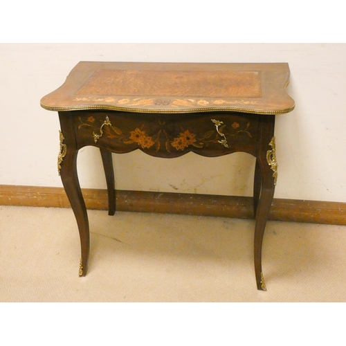 474 - French floral marquetry decorated shaped top writing table, with drawer, gilt metal mounts on cabrio... 