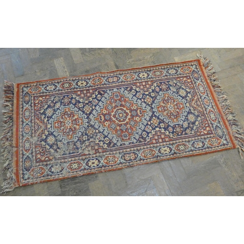 175 - A patterned wool pile Afghan Kilim style rug, 4'2 x 2'8