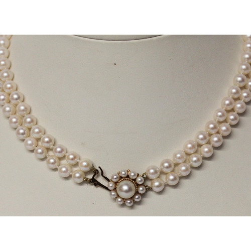 645 - A cultured pearl choker necklace, comprised of a double row of pearls to a 9ct gold circular pearl c... 