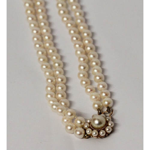 645 - A cultured pearl choker necklace, comprised of a double row of pearls to a 9ct gold circular pearl c... 