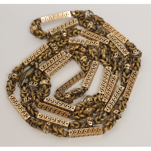 691 - Early 19th century long guard chain of fancy box links and granulated chain links, the clasp modelle... 