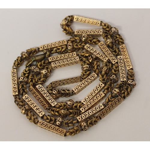 691 - Early 19th century long guard chain of fancy box links and granulated chain links, the clasp modelle... 