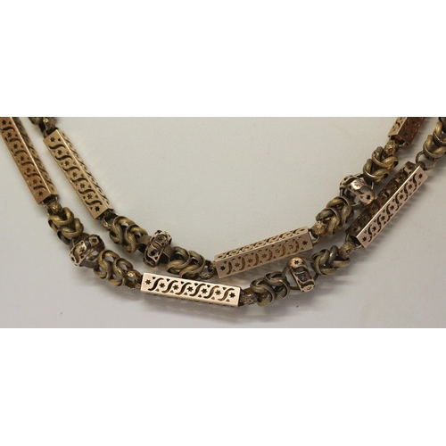 691 - Early 19th century long guard chain of fancy box links and granulated chain links, the clasp modelle... 