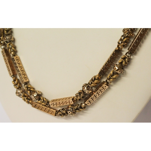 691 - Early 19th century long guard chain of fancy box links and granulated chain links, the clasp modelle... 