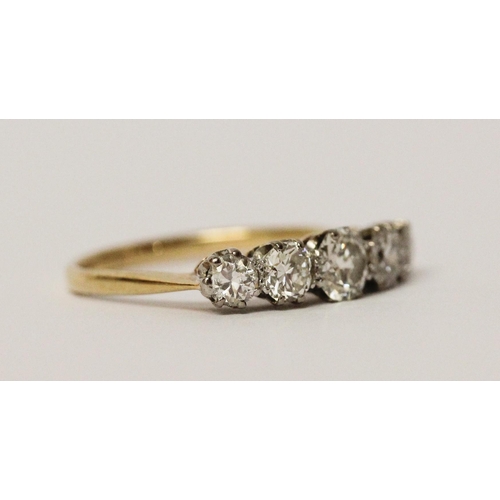 692 - A vintage five stone diamond ring of graduated brilliant cut diamonds, on unmarked yellow gold shank... 