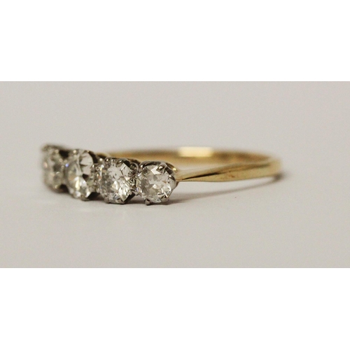 692 - A vintage five stone diamond ring of graduated brilliant cut diamonds, on unmarked yellow gold shank... 