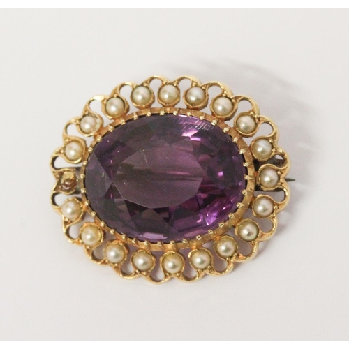 696 - An amethyst and pearl cluster oval brooch, in unmarked yellow gold frame. 30mm across, gross weight ... 